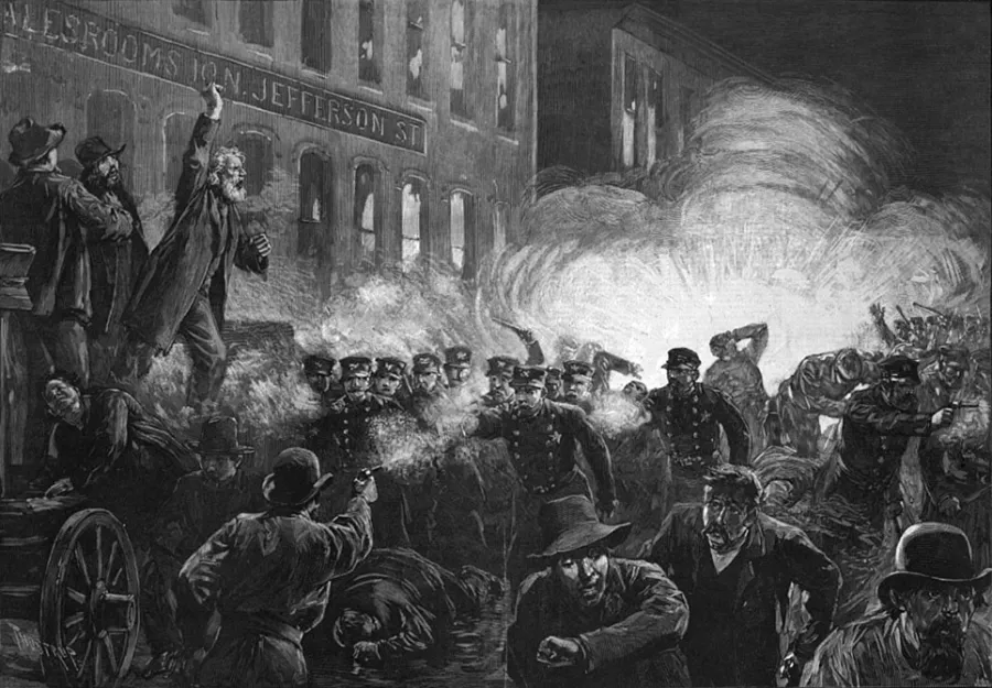 A historical illustration of the Haymarket Riots in black and white featuring workers protesting in front of a building and smoke