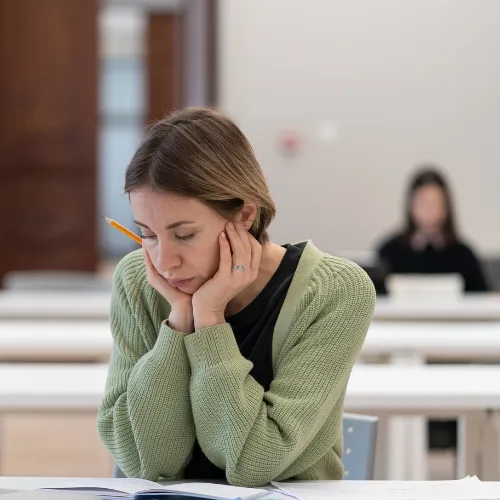 Worker looking down at her notebook